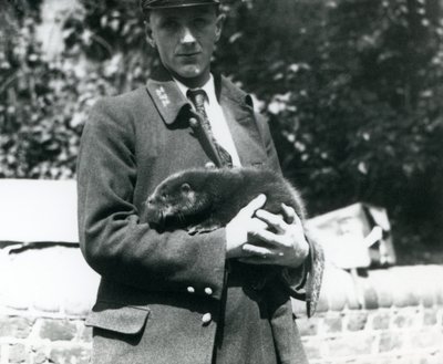 Keeper Leslie Martin Flewin Cradles an Otter Pup in His Arms at London Zoo by Frederick William Bond